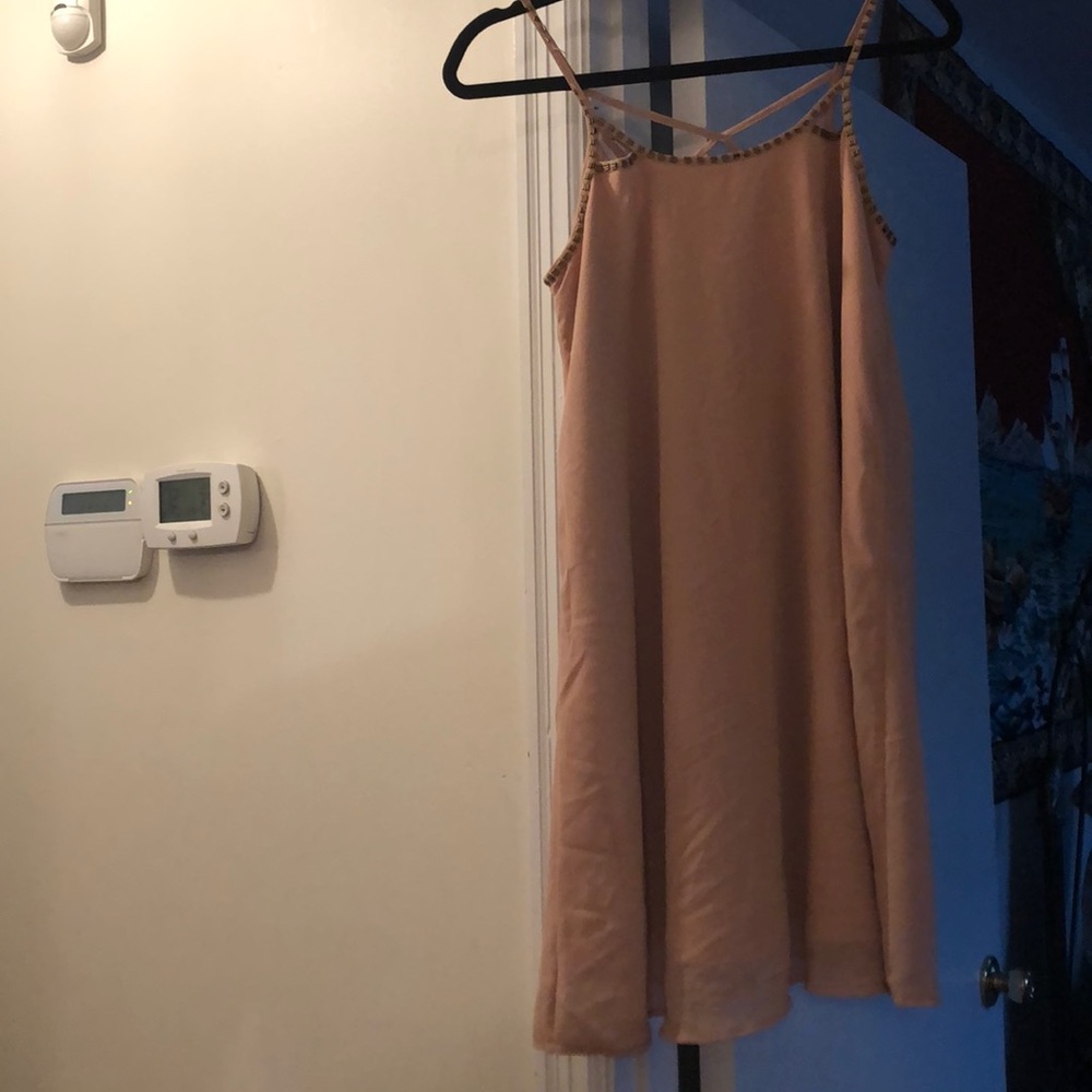 Has a couple beads missing but tan dress